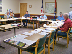people in a business meeting - Ozark Rivers Solid Waste Management District