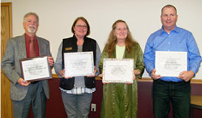 adults holding awards - Ozark Rivers Solid Waste Management District
